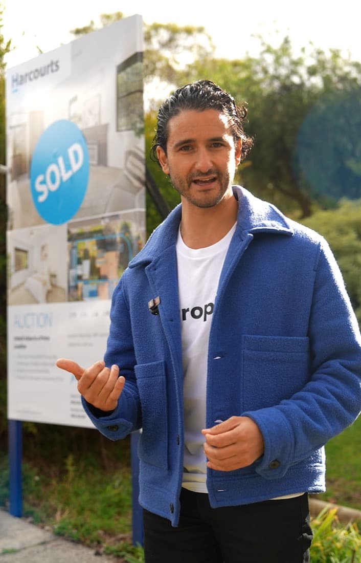 A PropApp agent beside a recently sold property