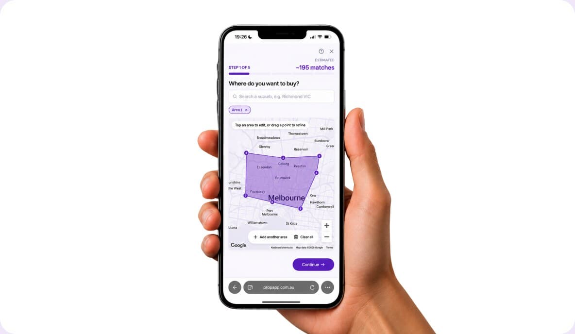 Hand holding a phone with a search area drawn over a Melbourne suburb map in PropApp.